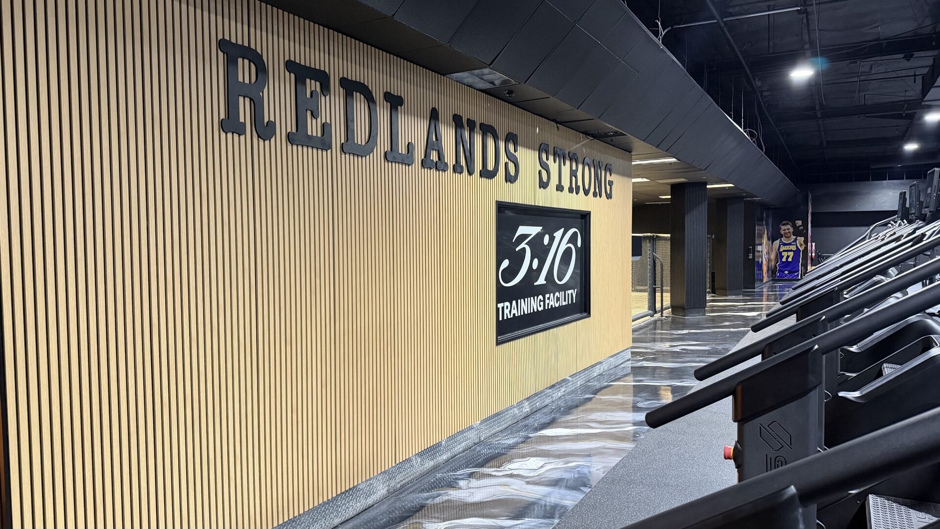 316 Training Facility front desk with gold lighting and 3:16 logo